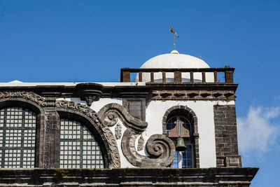 Low angle view of building against blue sky