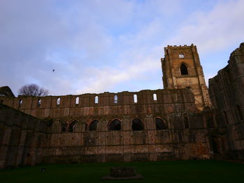 View of old ruin building against sky