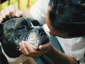 Close-up of hand holding dog