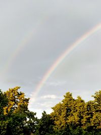 Low angle view of rainbow against sky