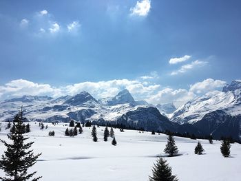 Scenic view of snowcapped mountains against sky