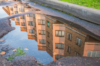 High angle view of buildings by street in city