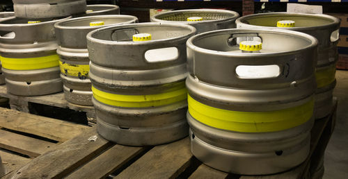 Close-up of yellow containers on table