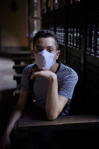 Portrait of boy sitting at home