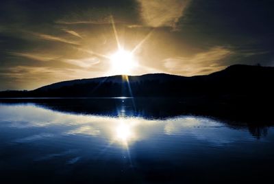 Scenic view of lake at sunset