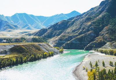 View of the turquoise river katun and the altai mountains, autumn season