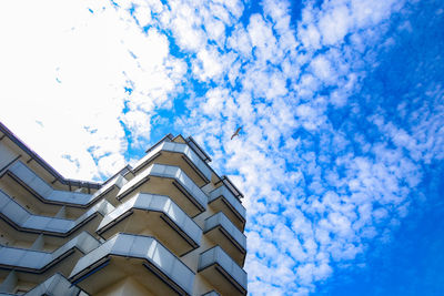 Low angle view of buildings against blue sky