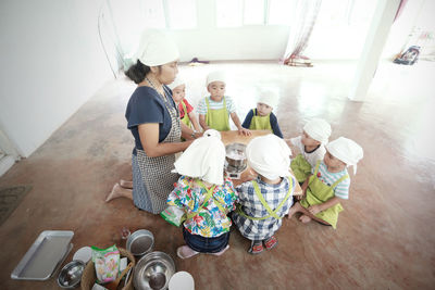 High angle view of people at home