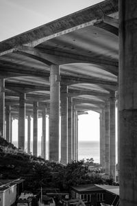 Low angle view of bridge seen through old building