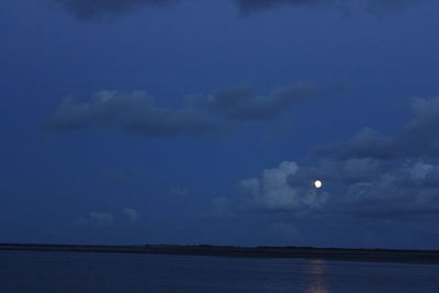 Scenic view of sea against sky at night