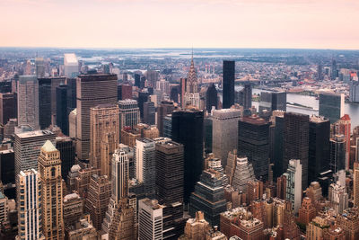 High angle view of modern buildings in city against sky