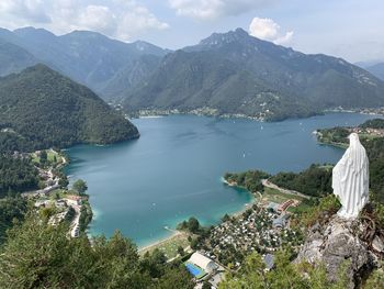 High angle view of sea and mountains against sky