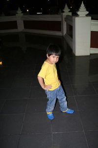 Portrait of smiling boy standing outdoors