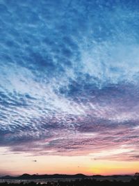 Low angle view of dramatic sky during sunset