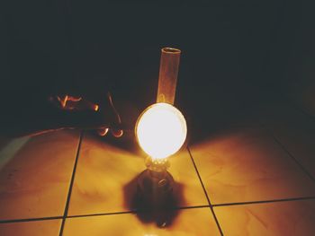 Illuminated light bulb in the dark