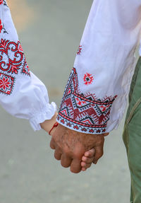 Cropped hand of woman holding hands