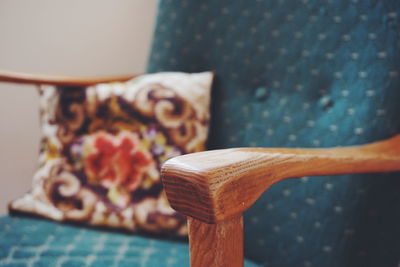 Close-up of retro style chair with cushion at home