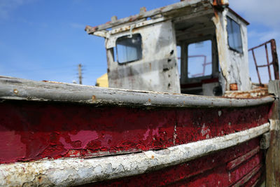 Low angle view of old boat against sky