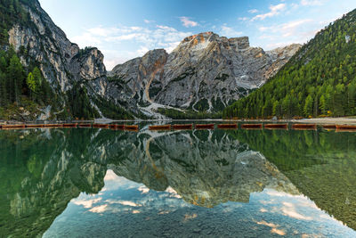 Scenic view of lake and mountains against sky