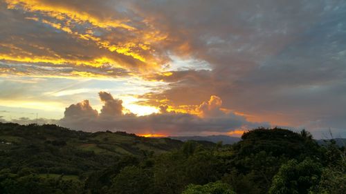 Scenic view of landscape against cloudy sky