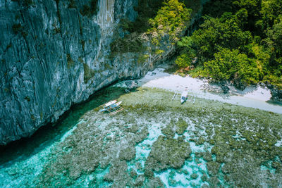 Scenic view of river flowing through rocks
