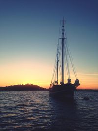 Silhouette of boats at sunset