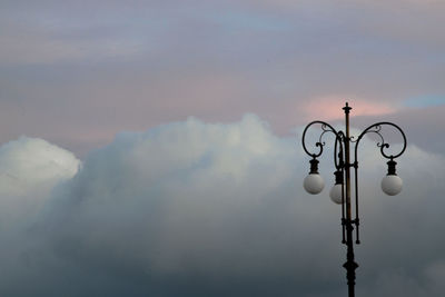 Low angle view of street light against sky