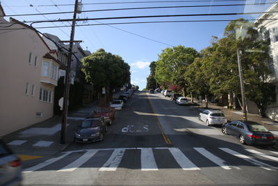 Vehicles on road along buildings