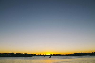 Scenic view of beach against sky during sunset