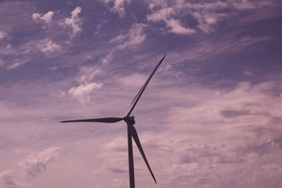 Low angle view of windmill against sky