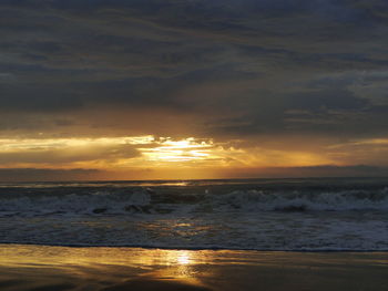 Scenic view of sea at sunset