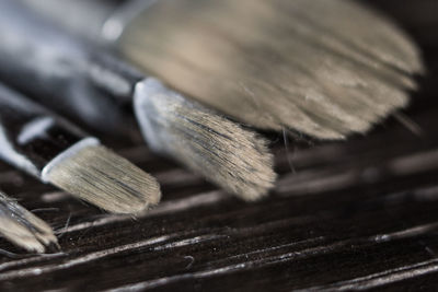 Close-up of paintbrushes on table