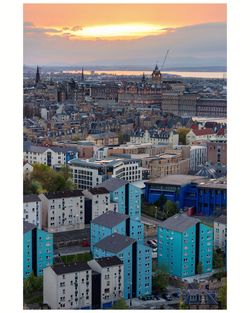 High angle shot of townscape against sky at sunset