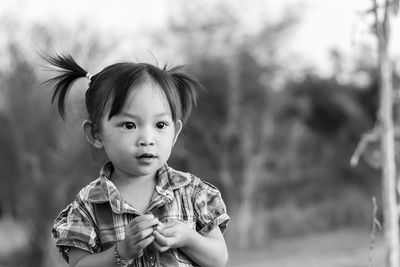 Portrait of cute girl outdoors