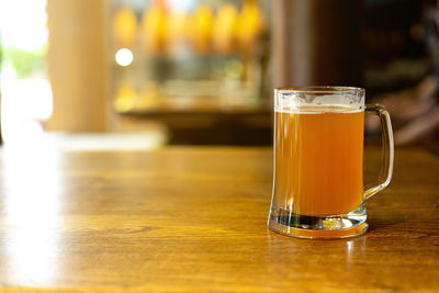 Close-up of beer glass on table