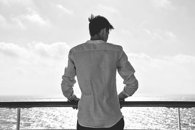 Rear view of man looking sea from observation point