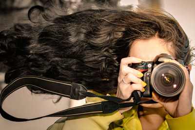 Woman photographing with camera