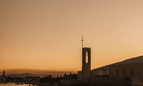 Low angle view of buildings against sky during sunset