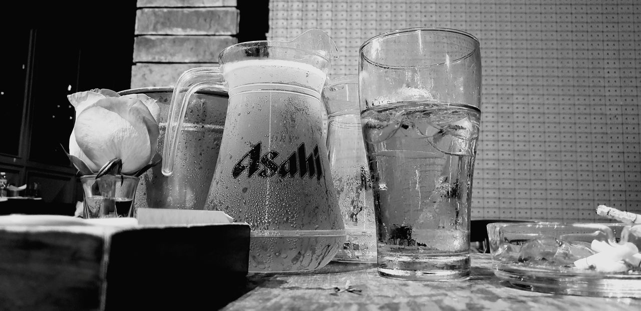 table, transparent, container, glass - material, still life, indoors, no people, bottle, jar, glass, close-up, freshness, household equipment, food and drink, drinking glass, drink, nature, water, refreshment