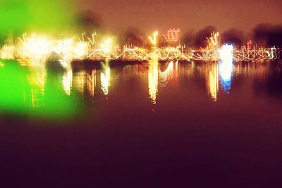 Reflection of illuminated buildings in water