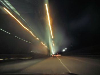 View of illuminated street at night