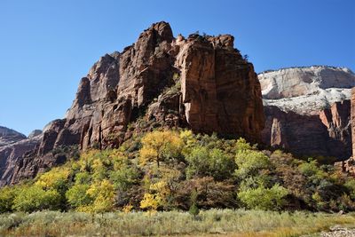 Scenic view of rocky mountains against clear sky