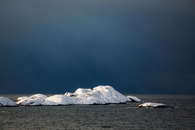 Scenic view of frozen sea against sky