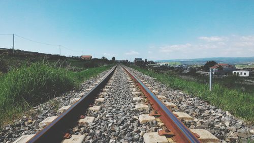 Railroad tracks against clear sky