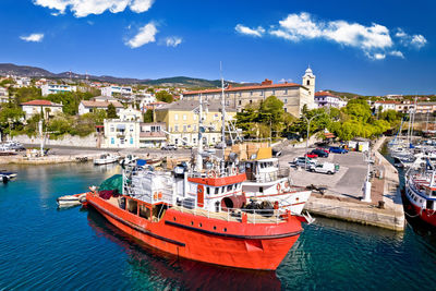 Boats moored at harbor