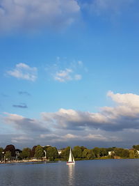 Scenic view of sea against cloudy sky