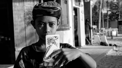 Portrait of boy drinking outdoors