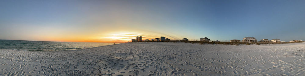 Scenic view of beach against sky during sunset