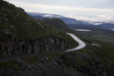 Scenic view of mountain road against sky