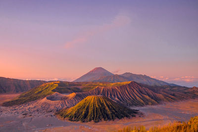 Scenic view of mountain range against sky during sunset